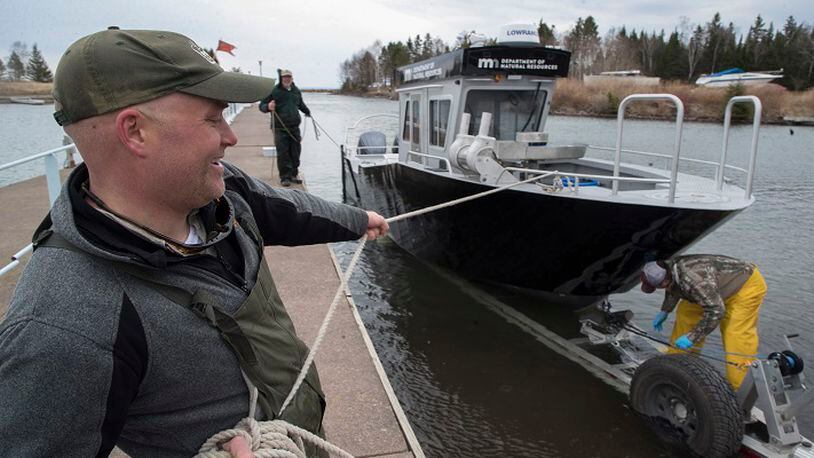 Cory Goldsworthy helps put the new Department of Natural Resources' 31-foot boat on a trailer during an annual spring population survey on Lake Superior on Tuesday, May 8, 2018 in Duluth, Minn. (Jerry Holt/Minneapolis Star Tribune/TNS)