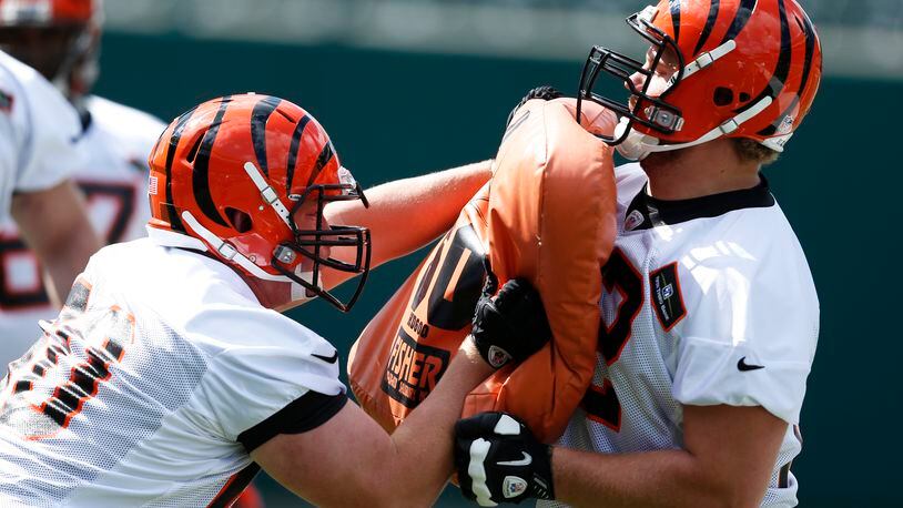 CINCINNATI, OH - MAY 12: Offensive linemen Tanner Hawkinson #72 and T.J. Johnson #60 of the Cincinnati Bengals work out during a rookie camp at Paul Brown Stadium on May 12, 2013 in Cincinnati, Ohio. (Photo by Joe Robbins/Getty Images)