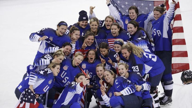 The United States team celebrates winning the women’s gold medal hockey game against Canada at the 2018 Winter Olympics in South Korea, Thursday, Feb. 22, 2018. (AP Photo/Matt Slocum)