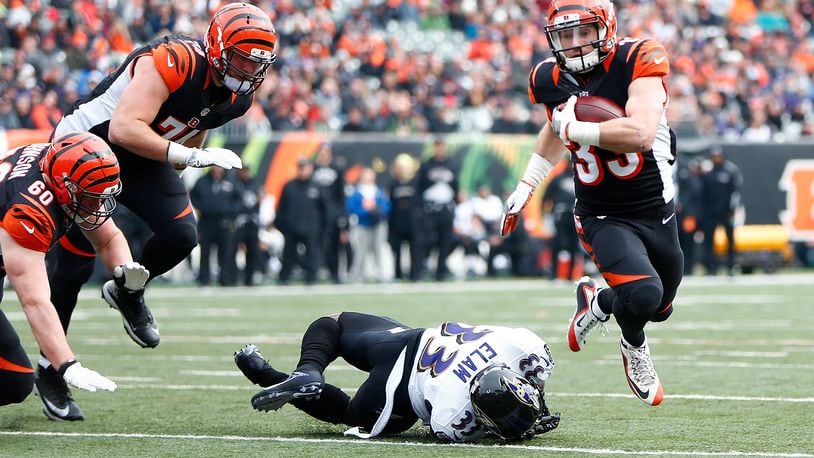 Bengals running back Rex Burkhead breaks a tackle by Matt Elam of the Ravens to score a touchdown at Paul Brown Stadium on January 1, 2017. That was the final game of the '16 season, a 27-10 win for Cincinnati.
