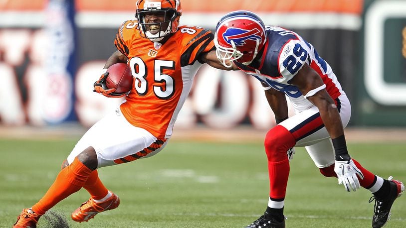 Former Bengals wide receiver Chad Johnson, aka as "Ochocinco," is seen here trying to get past Buffalo defender Drayton Florence in a 2010 game in Paul Brown Stadium.
