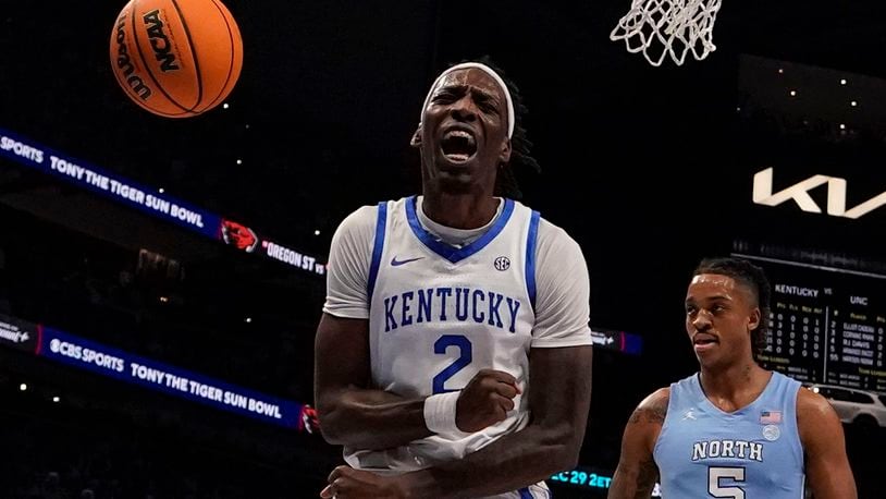 Kentucky forward Aaron Bradshaw (2) celebrates after scoring during the first half of an NCAA college basketball game against North Carolina in the CBS Sports Classic, Saturday, Dec. 16, 2023, in Atlanta, Ga. (AP Photo/Brynn Anderson)