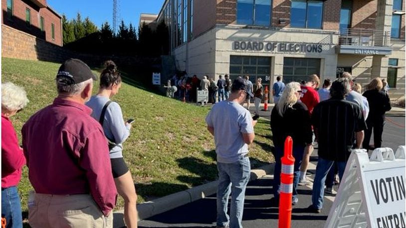 Warren County residents enjoyed a beautiful and sunny fall day as they stood in line waiting to cast an early vote at the Warren County Board of Elections on Sunday, Nov. 6, 2022. ED RICHTER/STAFF
