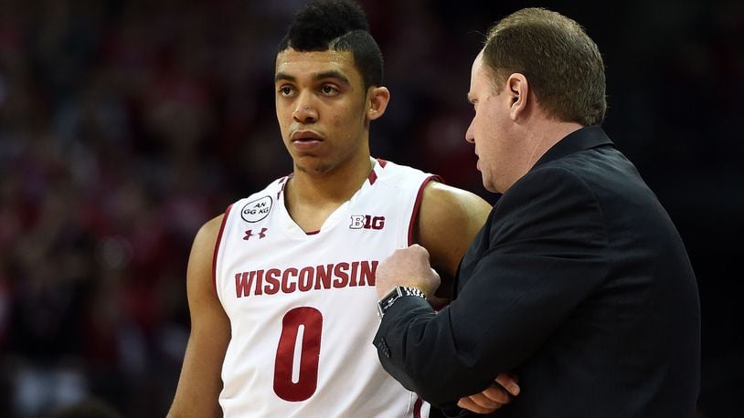 MADISON, WI - FEBRUARY 12:  Head coach Greg Gard of the Wisconsin Badgers speaks with D'Mitrik Trice #0 during a timeout against the Northwestern Wildcats at the Kohl Center on February 12, 2017 in Madison, Wisconsin.  Northwestern defeated Wisconsin 66-59. (Photo by Stacy Revere/Getty Images)