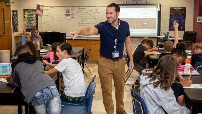 Spence Ford, a science teacher at Atlanta's Samuel M. Inman Middle School, says he intentionally brings lessons about climate change to the sixth graders in his earth science classes, but he doesn’t always know how or when he'll include them. Steve Schaefer/Special to the AJC