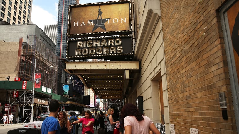 People, many who have been there for days, wait in line with dozens of others for tickets for the popular Broadway show Hamilton on June 21, 2016 in New York City. The Tony Award-winning Broadway hit has drawn huge crowds to the Richard Rogers theater in tin he hopes of getting increasingly scarce and expensive tickets. Carrying bed rolls, pillows and take-out food containers, many fans of the musical wait days in the heat and rain for a chance to get a cancellation ticket which are offered to the public once they're declined by members of the cast and crew.  (Photo by Spencer Platt/Getty Images)