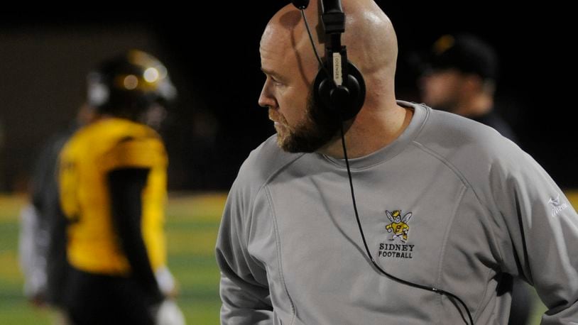 Sidney coach Adam Doenges led the Yellow Jackets to a 46-33 defeat of visiting Belmont in a D-II, Region 8 playoff opener. MARC PENDLETON / STAFF