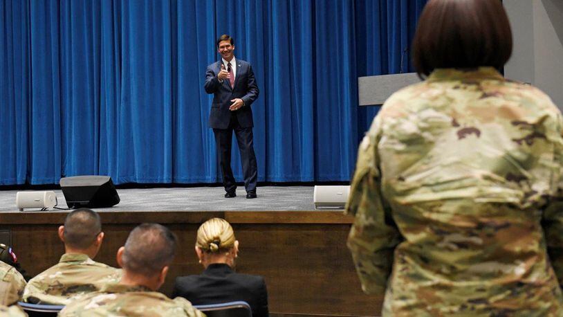 Secretary of Defense Mark T. Esper answers questions during a town hall-style meeting with Wright-Patterson Air Force Base civilian and uniformed Airmen and spouses inside Kenney Hall at the Air Force Institute of Technology Oct. 4. During his visit, Esper and his wife, Leah, toured several organizations on base. (U.S. Air Force photo/Ty Greenlees)