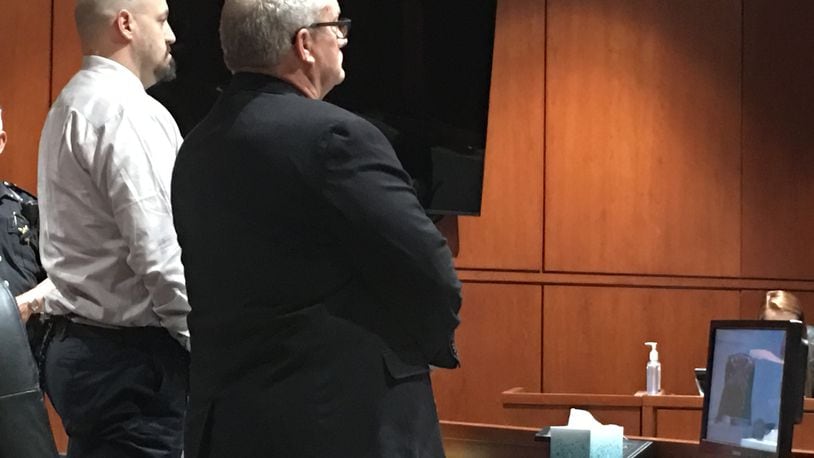 Freddie Green, 43, of Lebanon (at left) listens as Judge Timothy Tepe reads verdict forms finding Green guilty of murdering his father in December at their home.