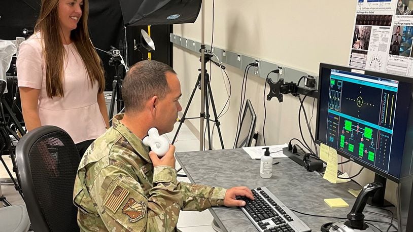 Maj. Robert Briggs performs a multi-task known as the “Multi-Attribute Task Battery,” developed by NASA to simulate piloting style tasks.  He is using the gammaCore transdermal vagal nerve stimulation (tVNS) unit to increase his alertness and reduce fatigue. (Courtesy photo)