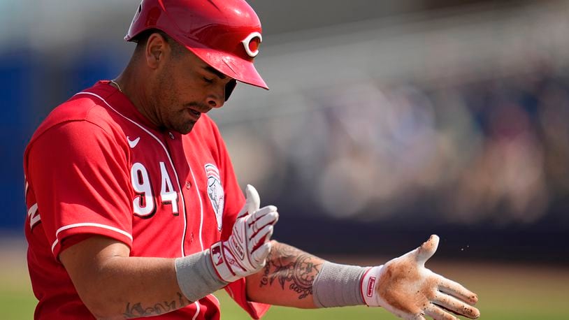 Cincinnati Reds' Christian Encarnacion-Strand celebrates after hitting a triple during the third inning of a spring training baseball game against the San Diego Padres, Wednesday, March 8, 2023, in Peoria, Ariz. (AP Photo/Abbie Parr)