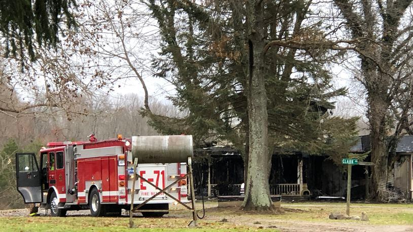 A two-story home in the 2300 bloack of Phillips Road outside Lebanon was badly damaged by a fire reported at 4:30 a.m. Tuesday, according to fire officials. LAWRENCE BUDD / STAFF
