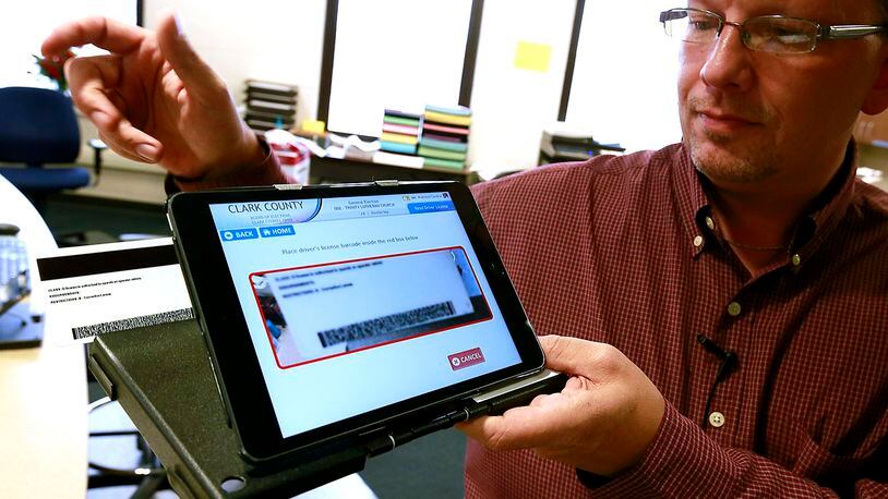 Butler County is moving to electronic poll books, similar to the one pictured here. STAFF FILE PHOTO