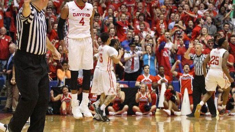 Dayton’s Charles Cooke reacts after forcing a turnover in the final minute against Duquesne on Tuesday, Feb. 9, 2016, at UD Arena in Dayton. David Jablonski/Staff