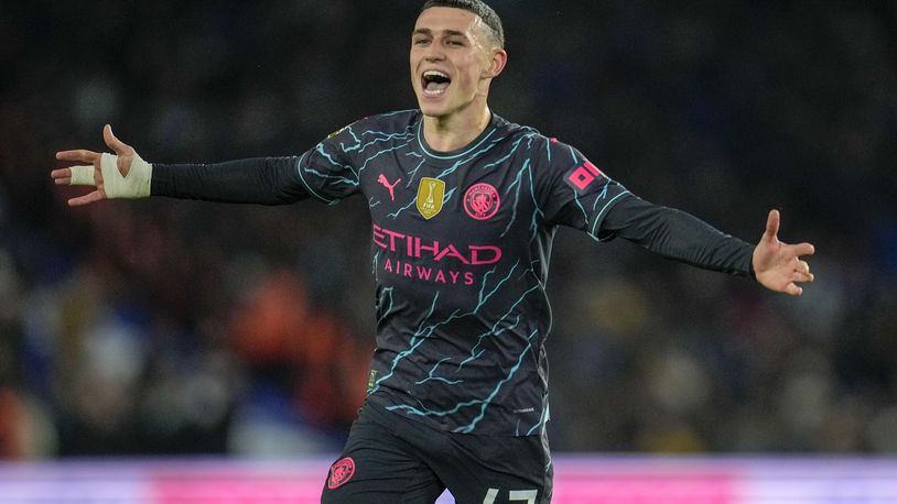 Manchester City's Phil Foden celebrates after scoring his side's second goal during the English Premier League soccer match between Brighton and Manchester City at the Falmer Stadium in Brighton, England, Thursday, April 25, 2024. (AP Photo/Kin Cheung)