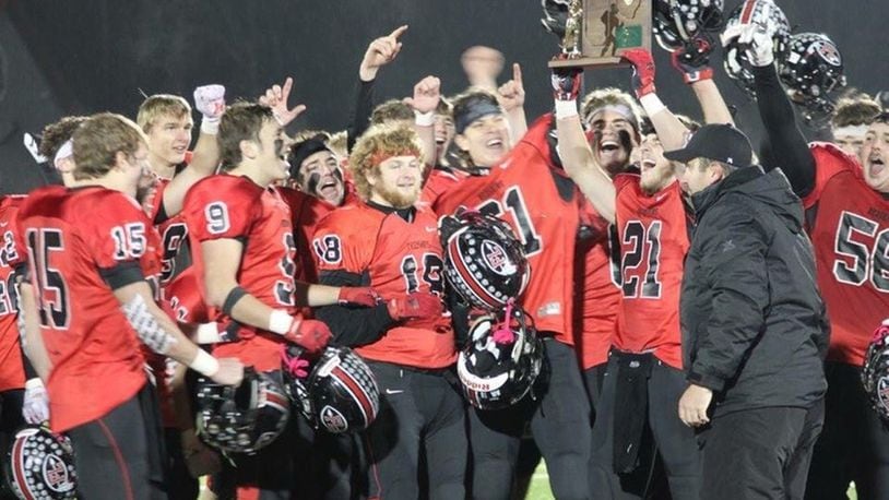 Fort Loramie coach Spencer Wells and the Redskins celebrate a 48-20 D-VII, Region 28 championship defeat of Convoy Crestview at Lima on Saturday, Nov. 17, 2018. CONTRIBUTED PHOTO