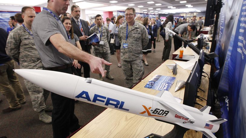 Barry Hellman, project manager for the Air Force Research Lab’s X-60A Hypersonic Research Vehicle, explains the project to AFRL personnel who were a part of the Inspire Tech Expo at the Dayton Convention Center in this May 2019 file photo.