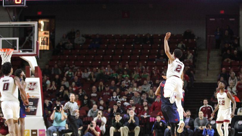Massachusetts guard Luwane Pipkins makes a go-ahead 3-pointer with 55 seconds left against Dayton on Saturday, Feb. 3, 2018, at the Mullins Center in Amherst, Mass. David Jablonski/Staff