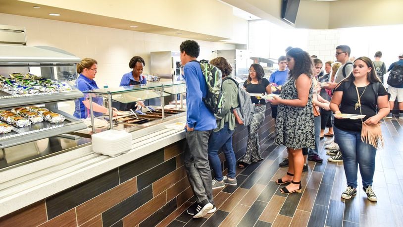 Students eat lunch in the cafeteria on the first day at Middletown High School Tuesday, Aug. 22 in Middletown. NICK GRAHAM/STAFF