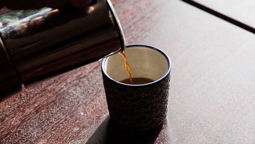 FILE-- Coffee is poured into a cup in New York, Feb. 5, 2016. The coffee industry is mulling how to fight back against a California judgeâs 2018 ruling that would require the beverage to be branded with cancer warning labels. The National Coffee Association, whose members include Starbucks and Dunkinâ Donuts, said that it was âcurrently considering all of its options, including potential appeals and further legal actions.â (Alex Welsh/The New York Times)
