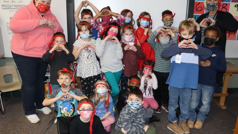 West Carrollton kindergarten students known as the Kindness Ninjas work with their teachers to do kind things for others without revealing their identity. Contributed.