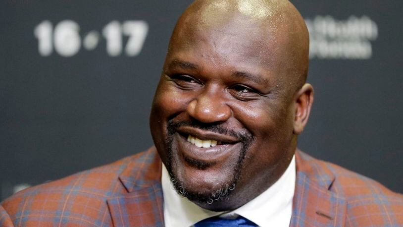 In this Dec. 22, 2016, file photo, retired Hall of Fame basketball player Shaquille O'Neal smiles as he talks to reporters during an NBA basketball news conference in Miami. O’Neal has been to enough parties before Super Bowls to know that he can do much better. “I’ve been to a million Super Bowl parties the past 15 years, and they’re all boring,” O’Neal said. “So this is Atlanta, I’m bringing the party to Atlanta. I wanted to do something big, so I called my friends.” (AP Photo/Alan Diaz, File)