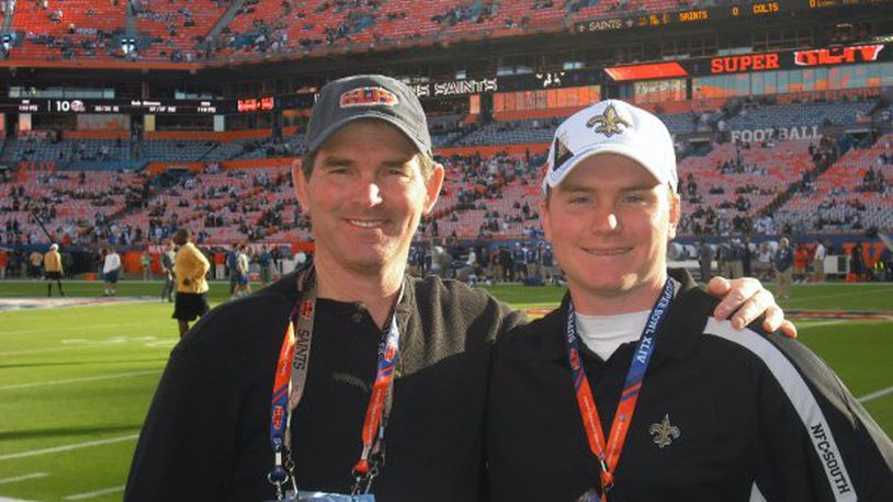 Bengals defensive coordinator Mike Zimmer (left) with his son Adam when they both coached with the Bengals. FILE PHOTO