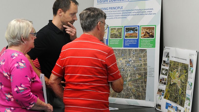 Xenia City Planner Brian Forschner, center, talks with residents about "neXtPlan" (a 10-year roadmap for Xenia development) at an open house Tuesday, April 16, 2024 at the Greene County media room. MARSHALL GORBY\STAFF