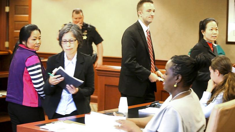Xiaoyan Guo, left, of Cincinnati, and Yunmei Wallis, far right, of Dayton who were both arrested for promoting prostitution during a Fairfield Twp. massage parlor raid, appeared before Judge Charles Pater in Butler County Common Pleas Court, Tuesday, June 2, 2015, for a pretrial hearing. GREG LYNCH / STAFF