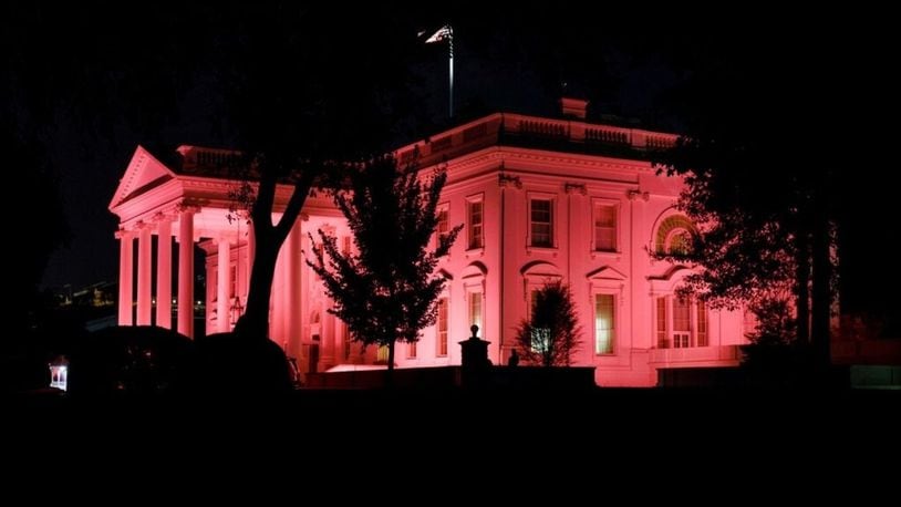 The White House is illuminated pink in Washington, Tuesday, Oct.1, 2019, in honor of Breast Cancer Awareness Month.