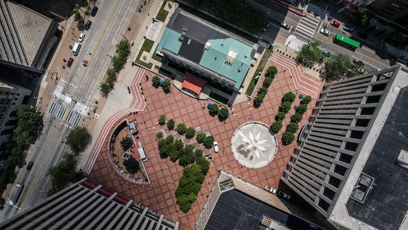 A new push is underway to try to remake Courthouse Square into the vibrant community asset. On a Friday at noon, there are few people enjoying the public space. JIM NOELKER/STAFF