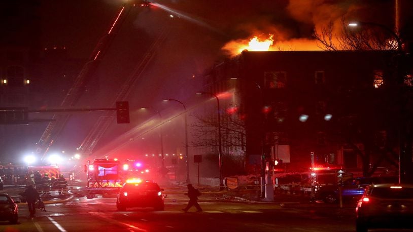 Firefighters battle a four-alarm fire at the Francis Drake Hotel apartments that broke out early Christmas Day morning.