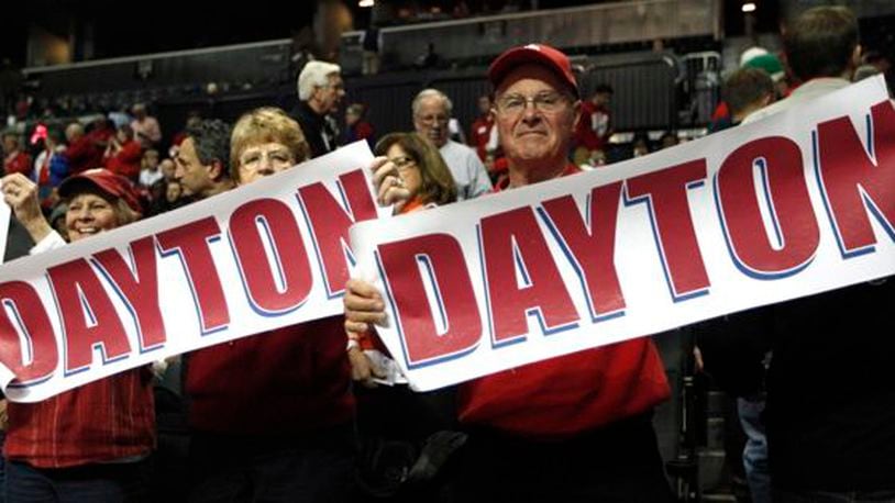 Dayton fans hold up signs during a game against Fordham in the second round of the A-10 tournament on Thursday, March 13, 2014, at the Barclays Center in Brooklyn, N.Y.