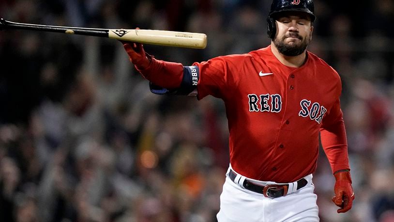 Boston Red Sox's Kyle Schwarber tosses his bat after a grand slam home run against the Houston Astros during the second inning in Game 3 of baseball's American League Championship Series Monday, Oct. 18, 2021, in Boston. (AP Photo/David J. Phillip)