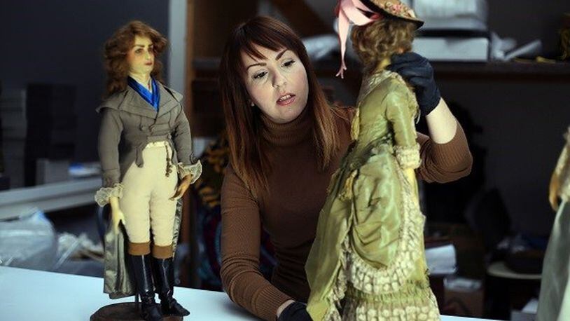 Conservation intern Marissa Stevenson tends to The Libbey Dolls at the Toledo Museum of Art collection. CONTRIBUTED