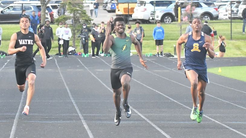 Northmont's James McKinney (middle) won the GWOC title in the 100-meter dash. Greg Billing/CONTRIBUTED