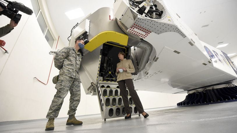 Secretary of the Air Force Barbara Barrett stands by the centrifuge used by the U.S. Air Force School of Aerospace Medicine, shown to her at Wright-Patterson Air Force Base Tuesday. Barrett met with Air Force personnel and toured facilities at the base including the U.S. Air Force School of Aerospace Medicine Epidemiology Laboratory, which is responsible for analyzing a majority of the COVID-19 tests in the Air Force. (U.S. Air Force photo by Ty Greenlees)