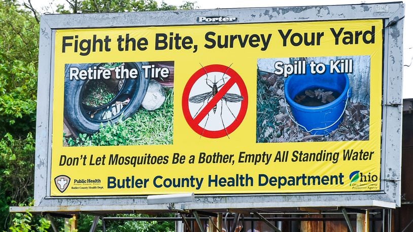 A billboard warns people to empty standing water to avoid mosquitoes. NICK GRAHAM/STAFF