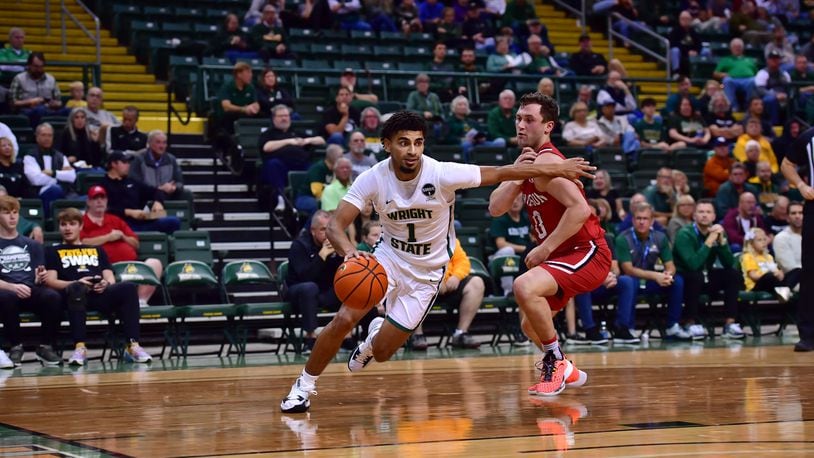 Wright State's Trey Calvin drives past a Davidson defender during Wednesday night's game at the Nutter Center. Joe Craven/Wright State Athletics