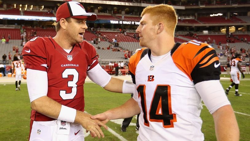 GLENDALE, AZ - AUGUST 24:  Quarterback Carson Palmer #3 of the Arizona Cardinals talks with quarterback Andy Dalton #14 of the Cincinnati Bengals following the preseason NFL game at the University of Phoenix Stadium on August 24, 2014 in Glendale, Arizona.  (Photo by Christian Petersen/Getty Images)