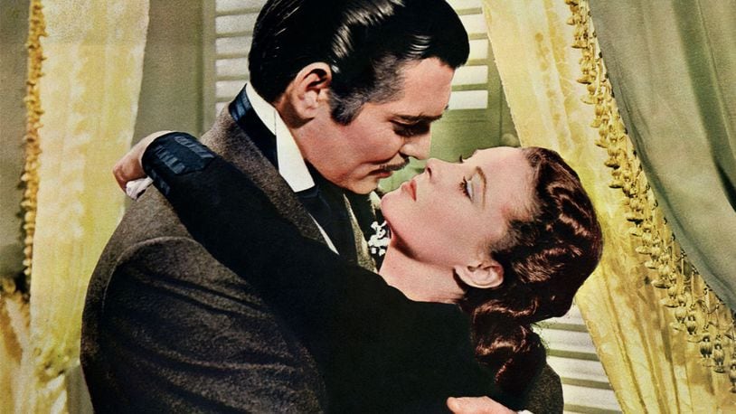 Rhett Butler (Clark Gable) embraces Scarlett O'Hara (Vivien Leigh) in a famous scene from the 1939 epic film Gone with the Wind.
