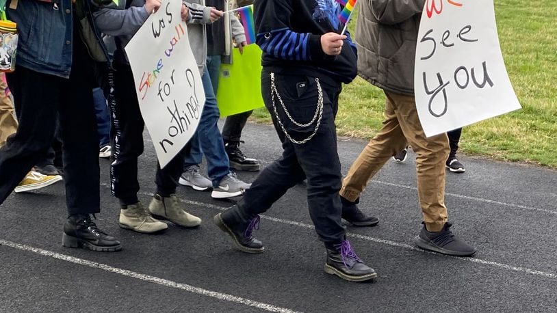 Students with signs march outside of the Stivers School for the Arts Friday morning in support of the school's LGBTQ+ students, who staged a walkout on Friday. Eileen McClory / Staff