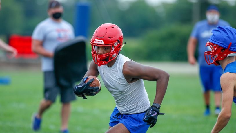 Northwestern High School wide receiver Nick Morton runs with the ball after catching a pass during the first day of football practice on Saturday, Aug. 1, 2020. Michael Cooper/CONTRIBUTED