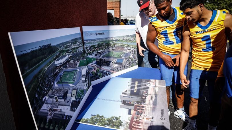 Ponitz High School athletes checkout the renderings of the Welcome Stadium renovation which was kickoff Wednesday afternoon following a groundbreaking ceremony.  JIM NOELKER/STAFF