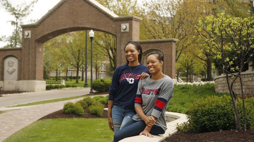Sisters Kyler Turner, left, and Kiara Turner are graduating from The University of Dayton with degrees in early childhood education on Sunday. Their college education path started at the University of Cincinnati, then two years at Sinclair before their final two years at UD. TY GREENLEES / STAFF