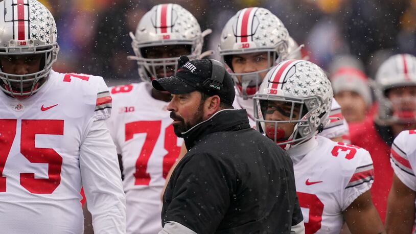 Ohio State head coach Ryan Day talks to the team during the first half of an NCAA college football game against Michigan, Saturday, Nov. 27, 2021, in Ann Arbor, Mich. (AP Photo/Carlos Osorio)