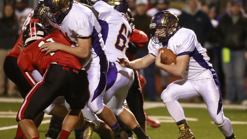 Mechanicsburg’s Dustin Knapp looks for a hole to carry the ball through against Jefferson. Bill Lackey/Staff