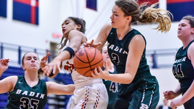 Badin’s Shelby Nusbaum (2) wins the battle for the ball with Talawanda’s Jazz Bennett during Wednesday night’s game in Oxford. Also on the play for the Rams are Macy Harper (35) and Claire McCurley (44). NICK GRAHAM/STAFF