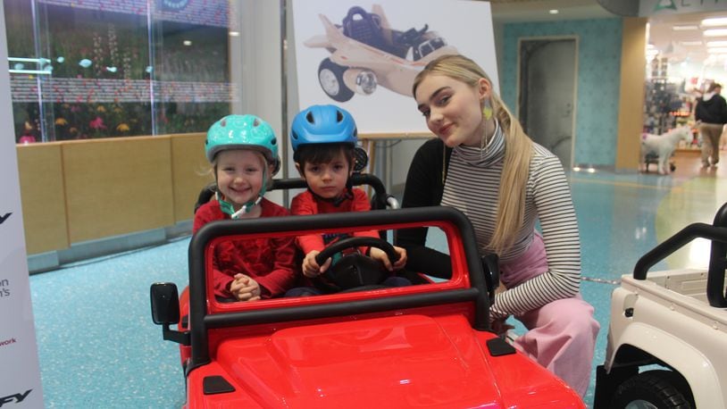 Meg Donnelly, star of  ABC’s “American Housewife” and the popular Disney Channel movie “Zombies,” visited Dayton Children’s as part of the announcement of Huffy’s donation to Dayton Children's and other Children’s Miracle Network hospitals.   The bicycle business donated $150,000 to Children’s Medical Network and $10,000 to Dayton Children’s. It pledged to donate battery-powered ride-ons like the one Cora Saunders, 4, and Charlie Herin, 3, are pictured in for kid’s heading into surgery to CMN’s 170 member hospitals. Photo by Amelia Robinson