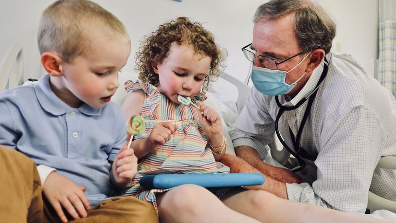 Dr. Robert Frenck chats with William, 3, and his sister, Lillian, 4, after they received doses of the Pfizer vaccine as part of a clinical trial at Cincinnati Children’s. Submitted photo.
